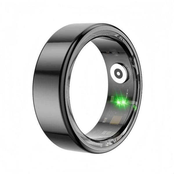 Black smart fitness ring with visible internal circuit and glowing green LED sensor, captured from a vertical side angle for a tech-focused look